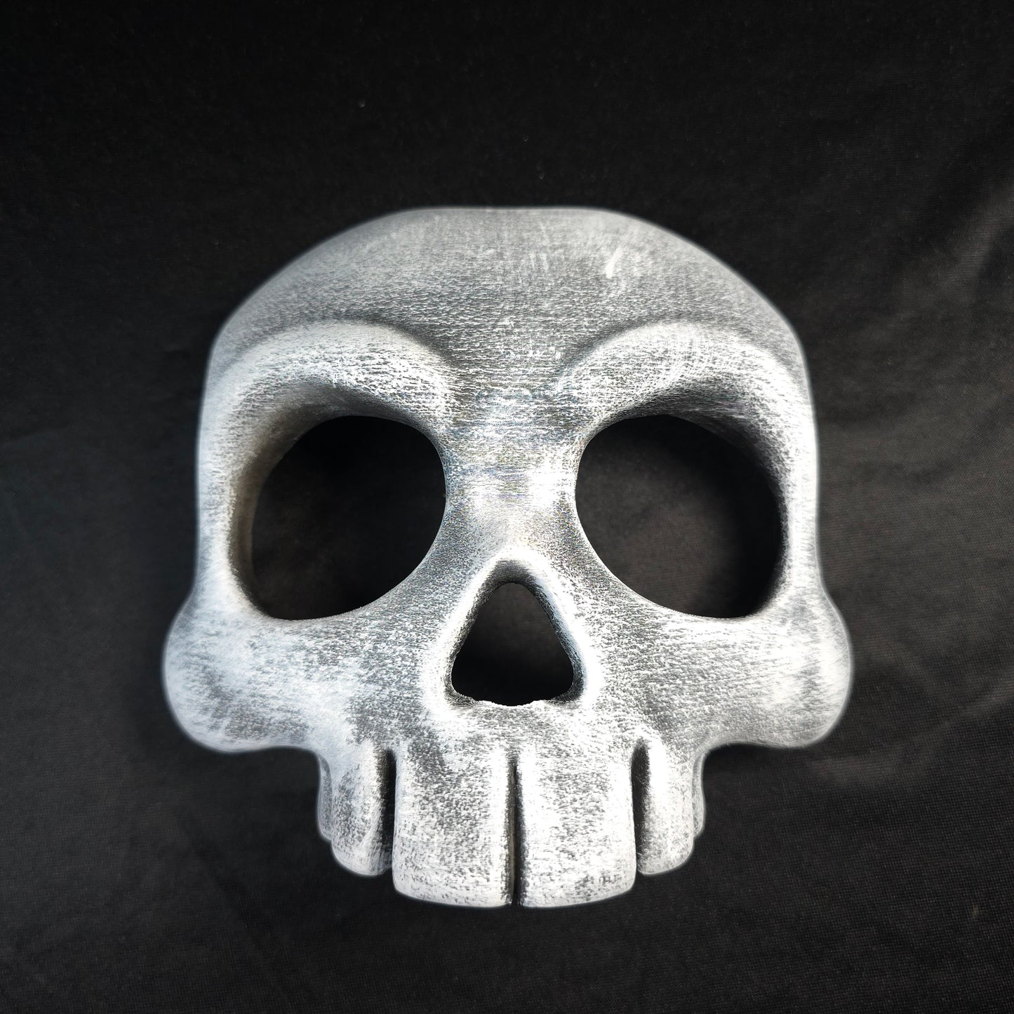 Skull-shaped object on a dark background